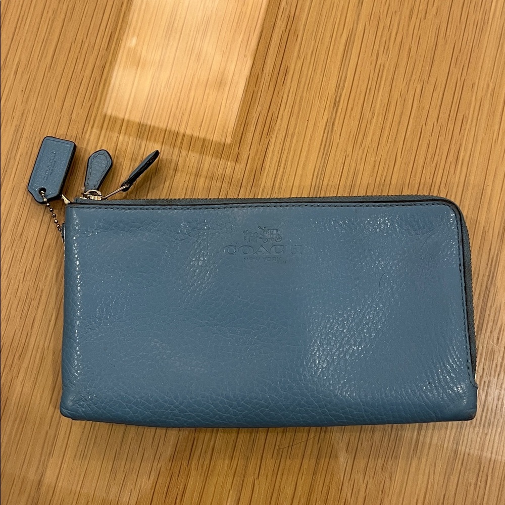 Coach blue leather double zip 8” x 4.25”
wristlet / wallet